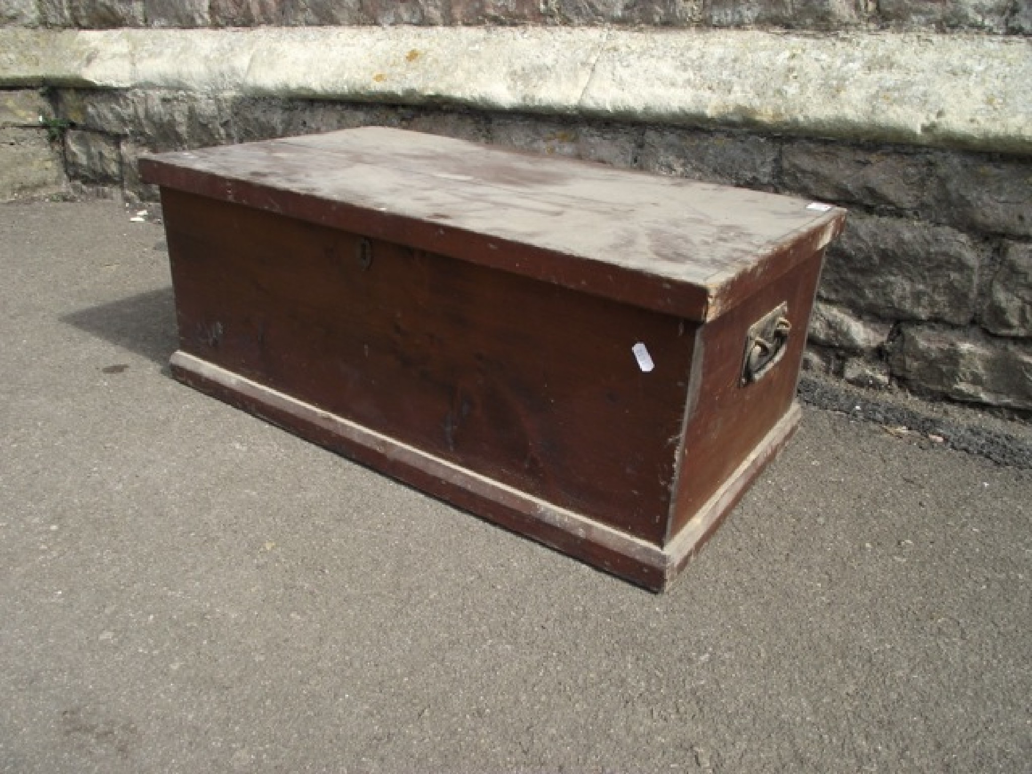 Appraisal: A th century shallow stained pine box with hinged lid