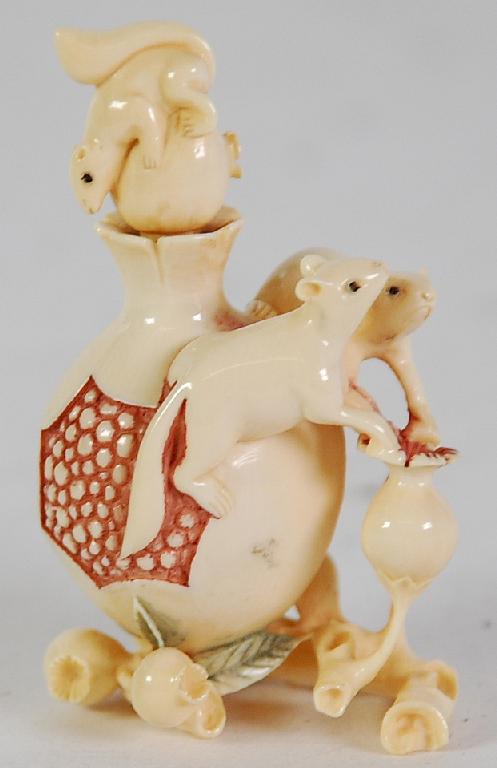 Appraisal: TWENTIETH CENTURY JAPANESE CARVED AND STAINED IVORY SNUFF BOTTLE in