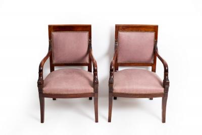 Appraisal: A pair of Empire style mahogany open armchairs the backs