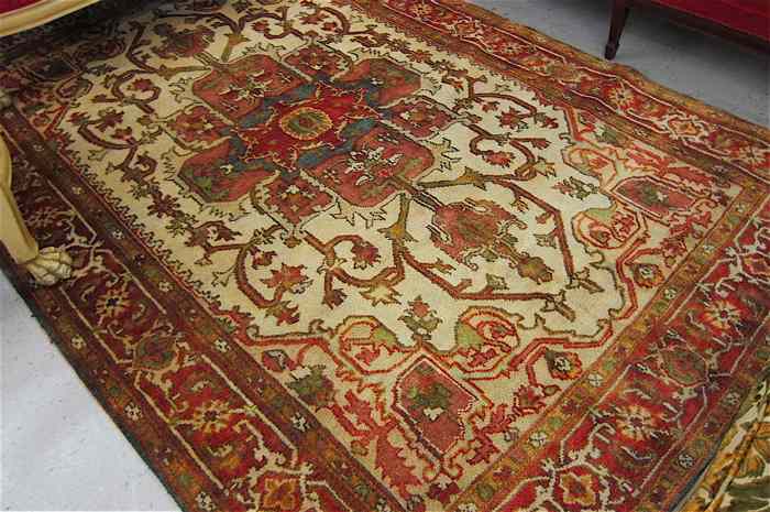 Appraisal: HAND KNOTTED ORIENTAL CARPET Persian Serapi design centering a geometric