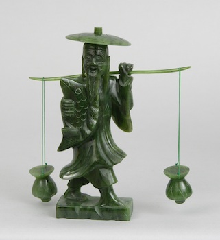 Appraisal: A Carved Jade Figurine of a Fisherman Carved in sections