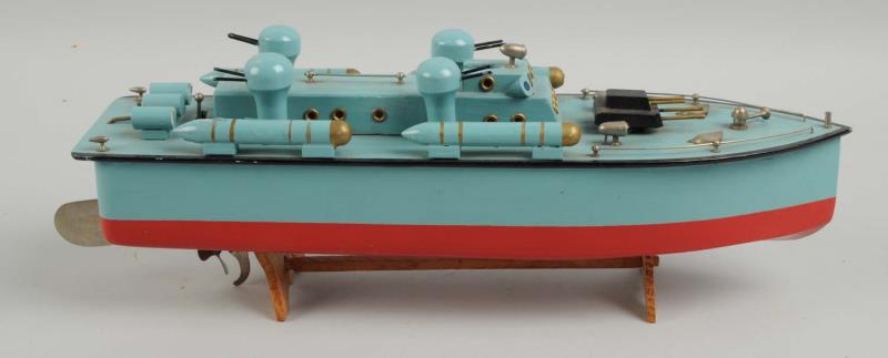 Appraisal: Japanese Toy Boat Wooden boat comes with four different torpedo's