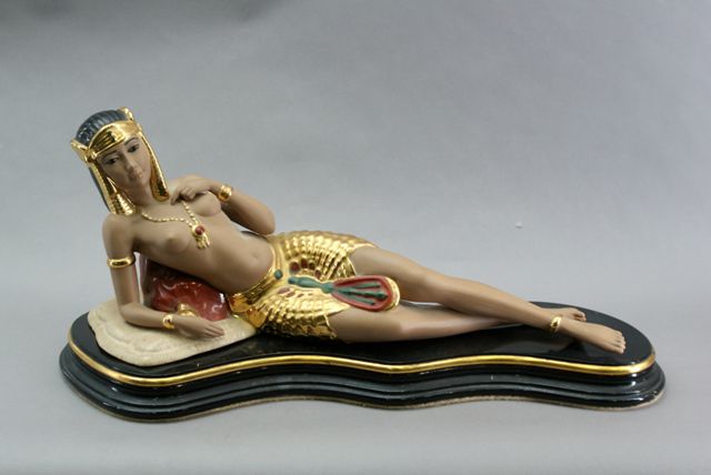 Appraisal: A Nadal figure of Cleopatra reclining cm long with stand