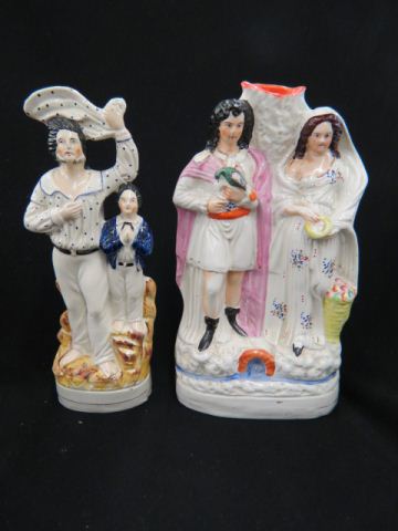 Appraisal: Staffordshire Pottery Figurines couple with one holding bird other with