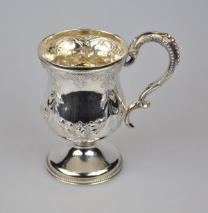 Appraisal: A Victorian silver Christening mug of baluster form embossed and