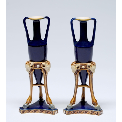 Appraisal: A pair of Minton majolica miniature amphorae and tripod stands