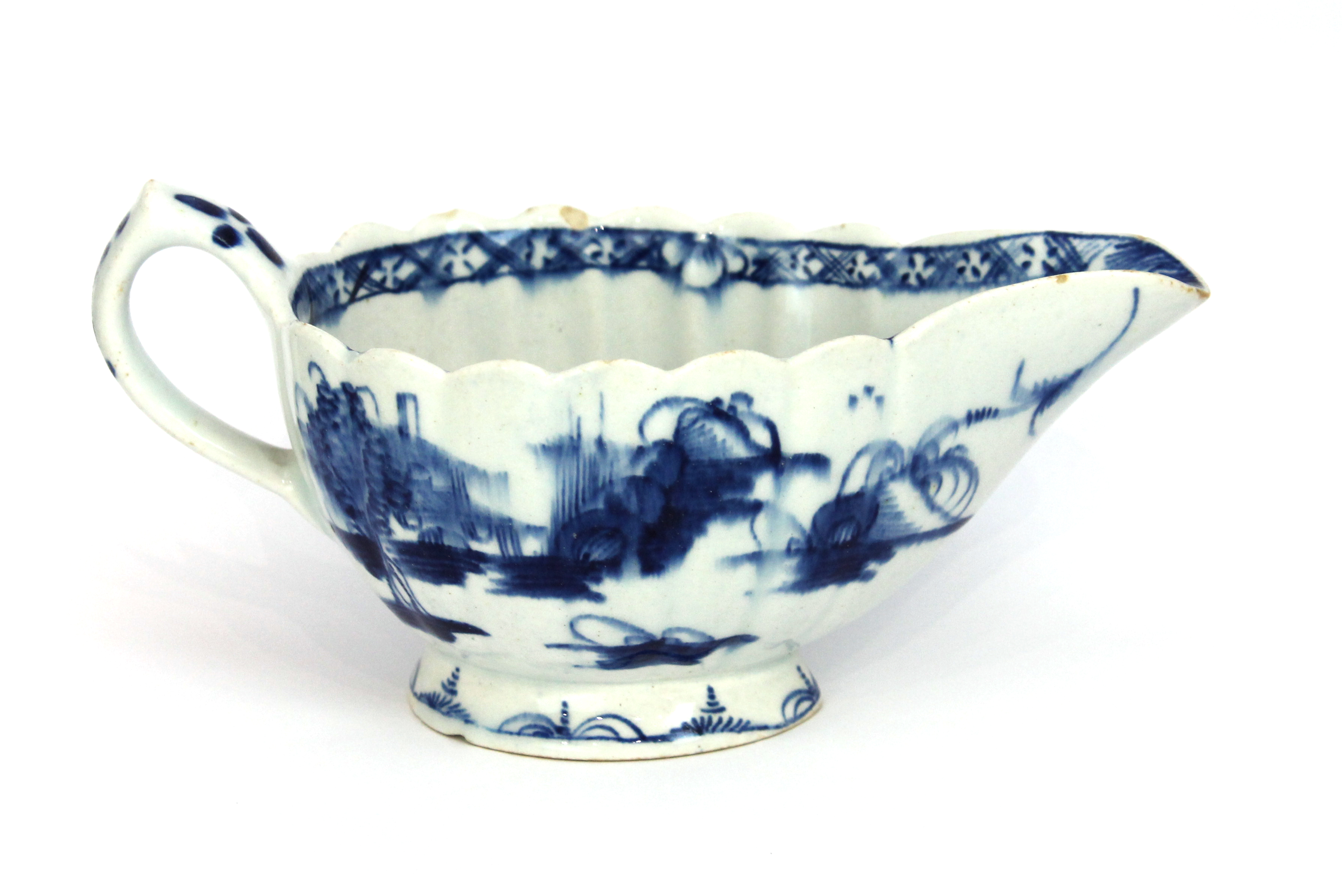 Appraisal: A Bow blue and white oval fluted sauceboat circa painted