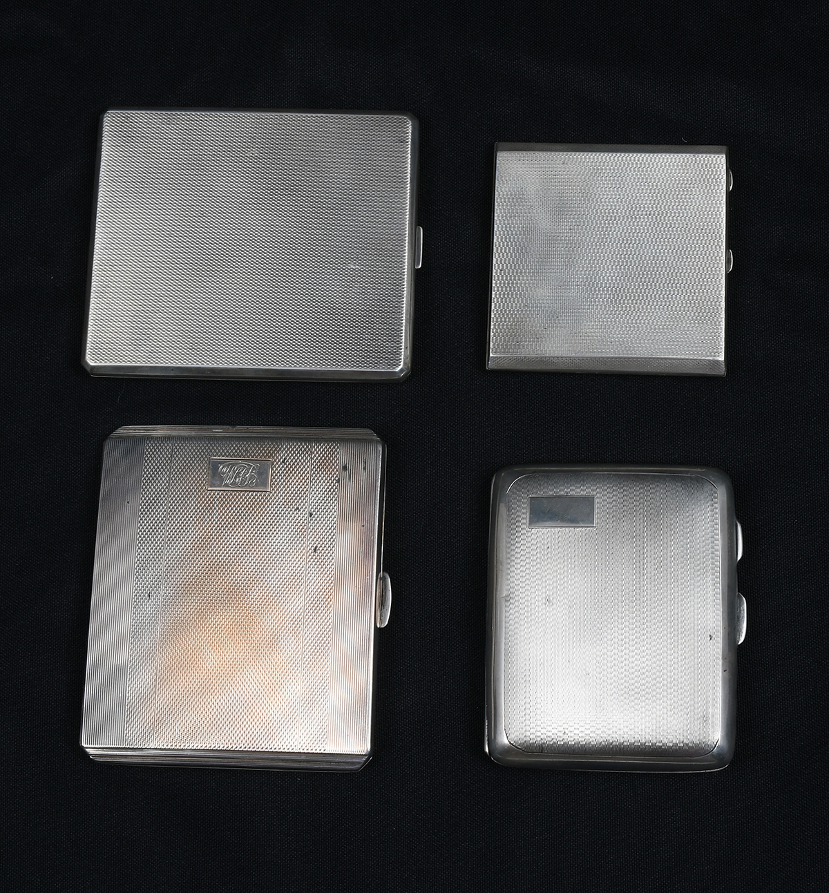 Appraisal: ART DECO SILVER CIGARETTE CASES COMPACT Comprising - Curved English