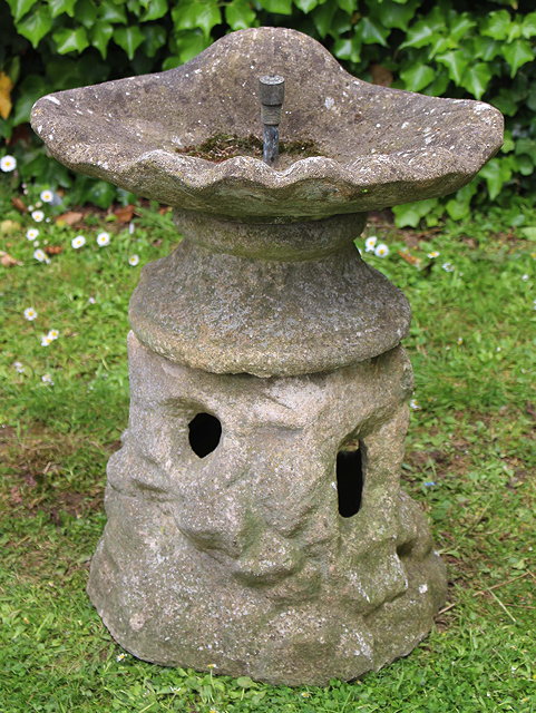 Appraisal: AN OLD CAST CONCRETE FOUNTAIN with shell moulded top and