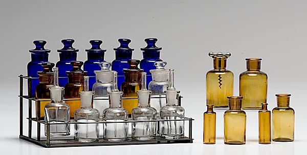 Appraisal: PHARMACY DISPLAY WITH BOTTLES brass display housing small apothecary jars