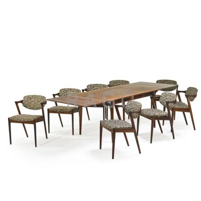 Appraisal: KAI KRISTIANSEN b Draw-leaf dining table and eight chairs Denmark