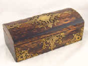 Appraisal: A Victorian coromandel veneered box with brass strapwork style mounts