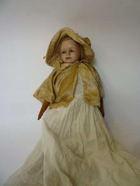 Appraisal: A wax covered shoulder head girl doll with inset blue