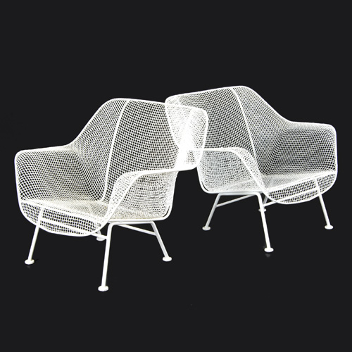 Appraisal: RUSSELL WOODARD Pair of white enameled wire mesh lounge chairs