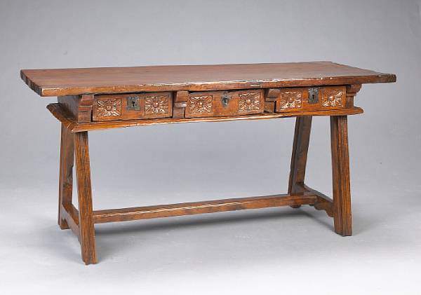 Appraisal: An Italian Baroque walnut center table The rectangular molded top