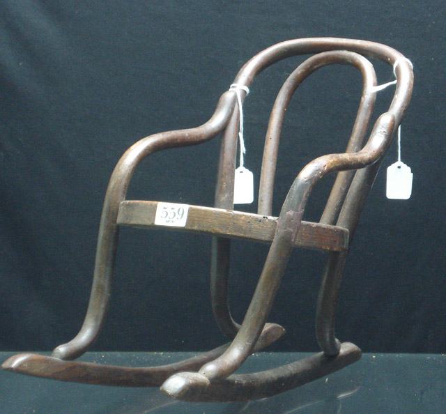 Appraisal: A dolls bentwood rocker with caned seat circa