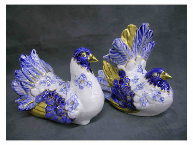 Appraisal: Pair of nesting hens Italian porcelain artist signed by Sergio