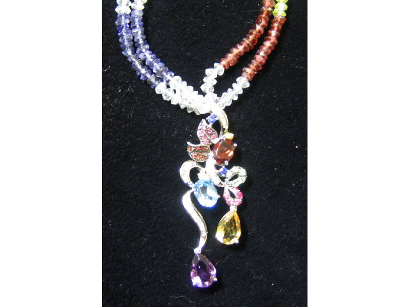 Appraisal: GEMSTONE DIAMOND AND BEAD NECKLACE With oval and faceted garnet