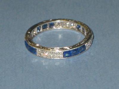 Appraisal: A DIAMOND AND SAPPHIRE ETERNITY RING comprising sets of three