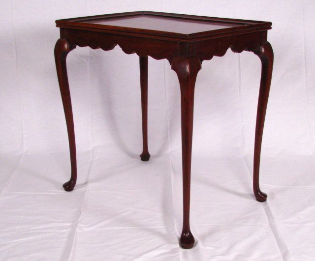 Appraisal: Queen Anne cherry occasional table classic cabriole leg pad foot