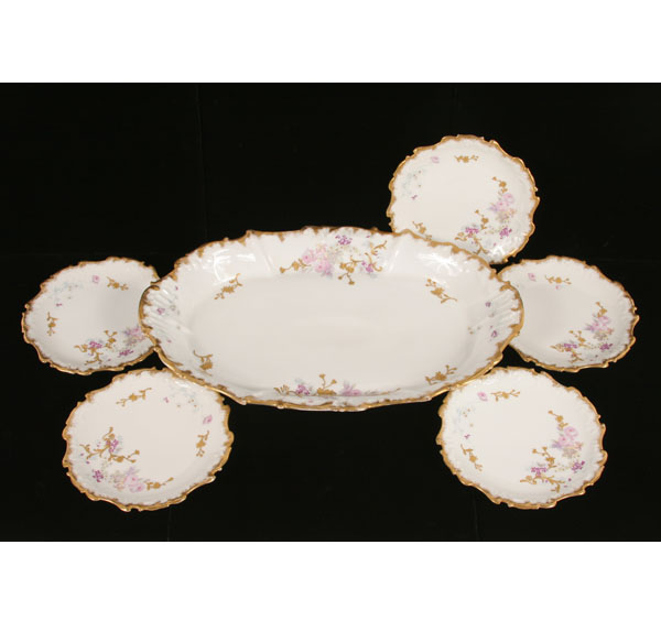 Appraisal: Limoges gilt and hand painted platter and dishes transfer and