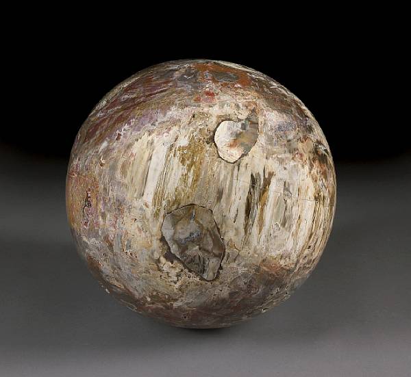 Appraisal: Petrified Wood Sphere Madagascar Characterized by its rich coloration with