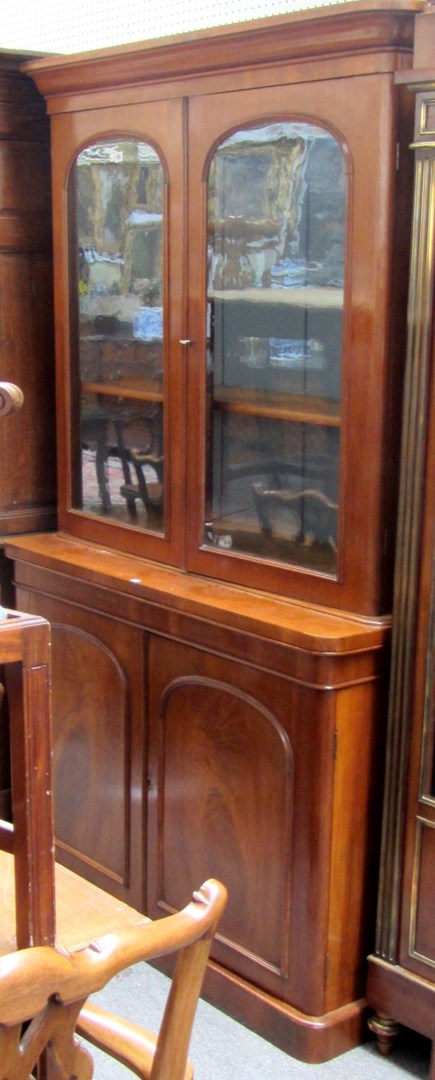 Appraisal: A Victorian mahogany bookcase cabinet the pair of glazed arched