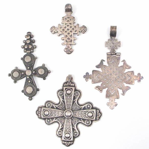 Appraisal: A group of twenty eight silver and white metal crosses