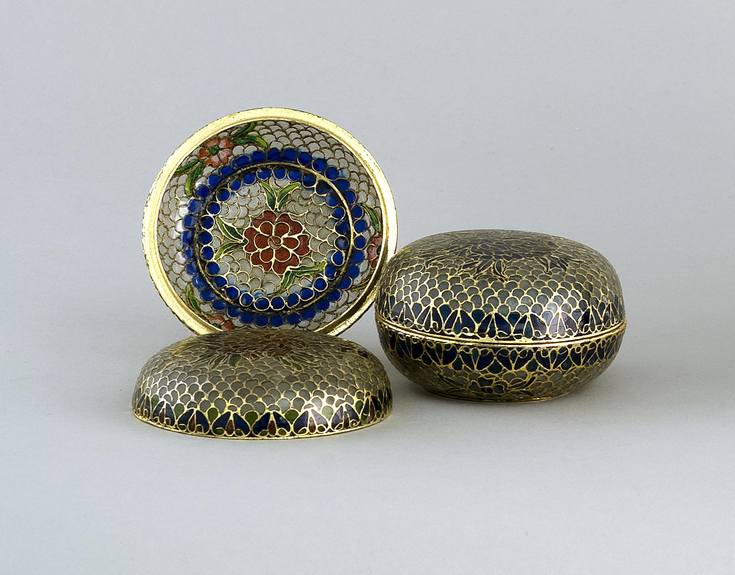 Appraisal: PAIR OF PLIQUE- -JOUR ENAMELED COVERED BOXES In circular form