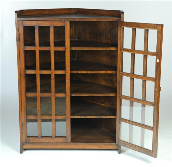 Appraisal: ARTS CRAFTS CORNER BOOKCASE American early th century quarter sawn