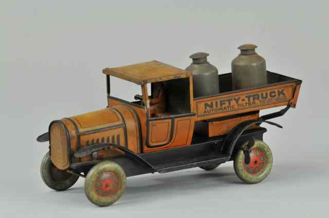 Appraisal: NIFTY AUTOMATIC TILTING TRUCK Lithographed tin clockwork w original driver