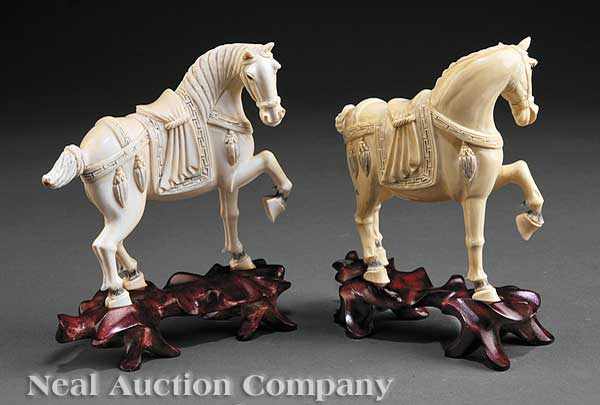 Appraisal: A Pair of Chinese Carved and Tinted Ivory Horses each