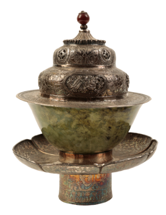 Appraisal: A TIBETAN SILVER 'DHAKA' TEA BOWL STAND with engraved and