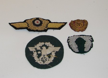 Appraisal: Lot of embroidered Officer's cap devices and Police eagle shoulder