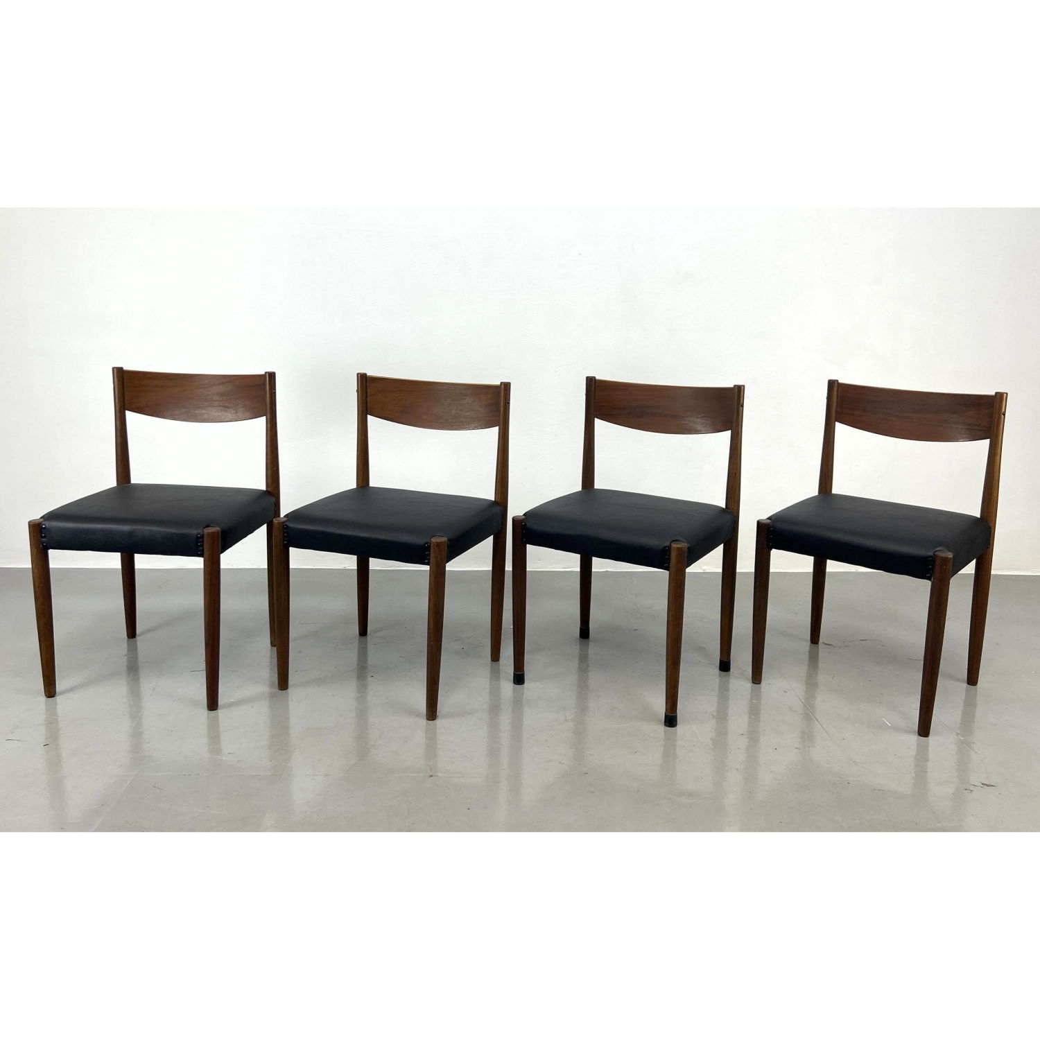 Appraisal: Set American Modern Walnut Dining Chairs Simple construction with black