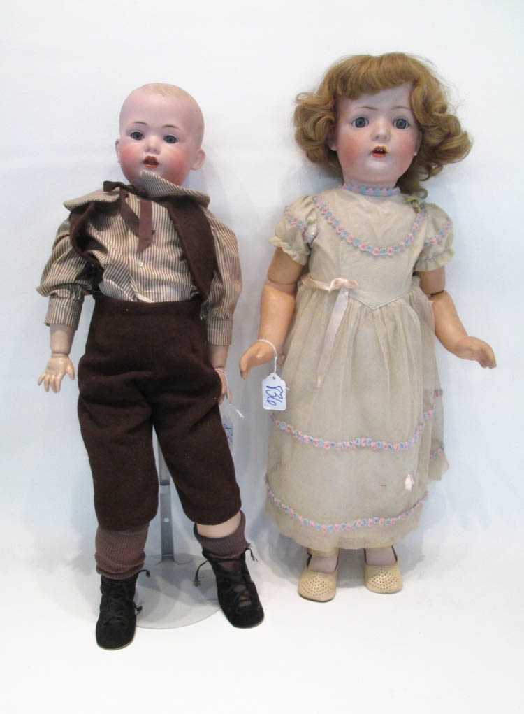 Appraisal: TWO GERMAN BISQUE SOCKET HEAD CHILD DOLLS boy doll by