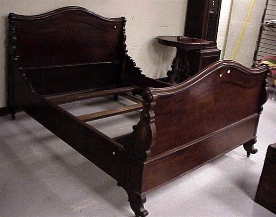 Appraisal: Victorian bedstead rosewood arched headboard and foot board with applied