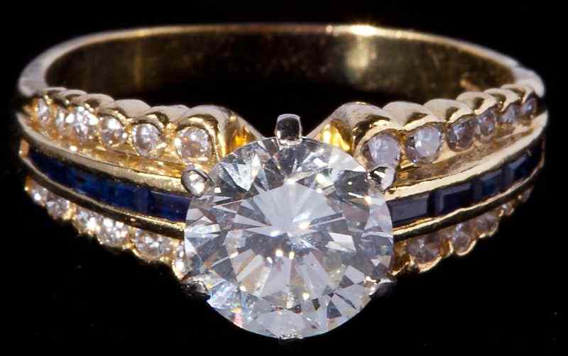 Appraisal: Diamond and Sapphire Ringcentering on one round brilliant cut diamond