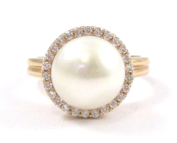 Appraisal: PEARL DIAMOND AND FOURTEEN KARAT GOLD RING with round-cut diamonds