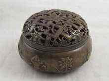 Appraisal: A Chinese bronze incense burner with pierced cover cast mark