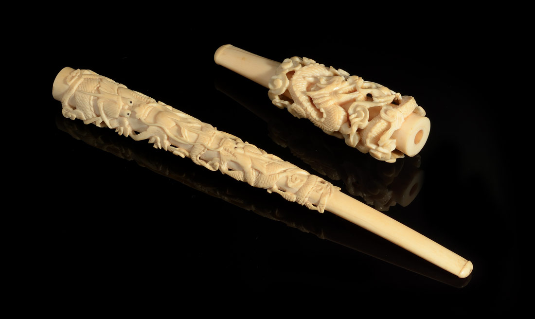 Appraisal: CARVED IVORY CIGARETTE HOLDERS Each with carved dragon motifs one