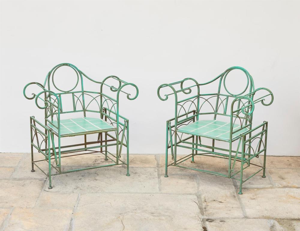 Appraisal: A pair of Art Deco wrought iron garden glider chairs