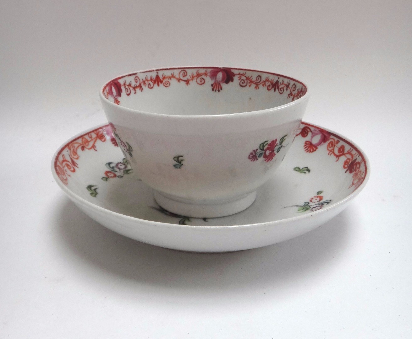 Appraisal: A New Hall teabowl and saucer circa painted with pattern