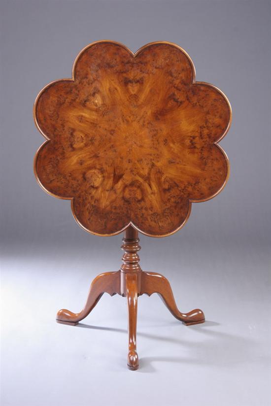 Appraisal: GEORGIAN STYLE BURLED WALNUT TILT-TOP STAND th century Finely-figured eight-lobbed