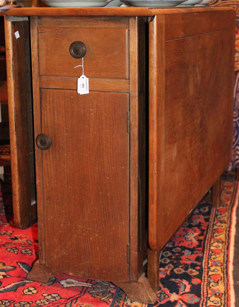 Appraisal: MODERN OAK DROP LEAF TABLE WITH DRAWER AND CUPBOARD DOOR