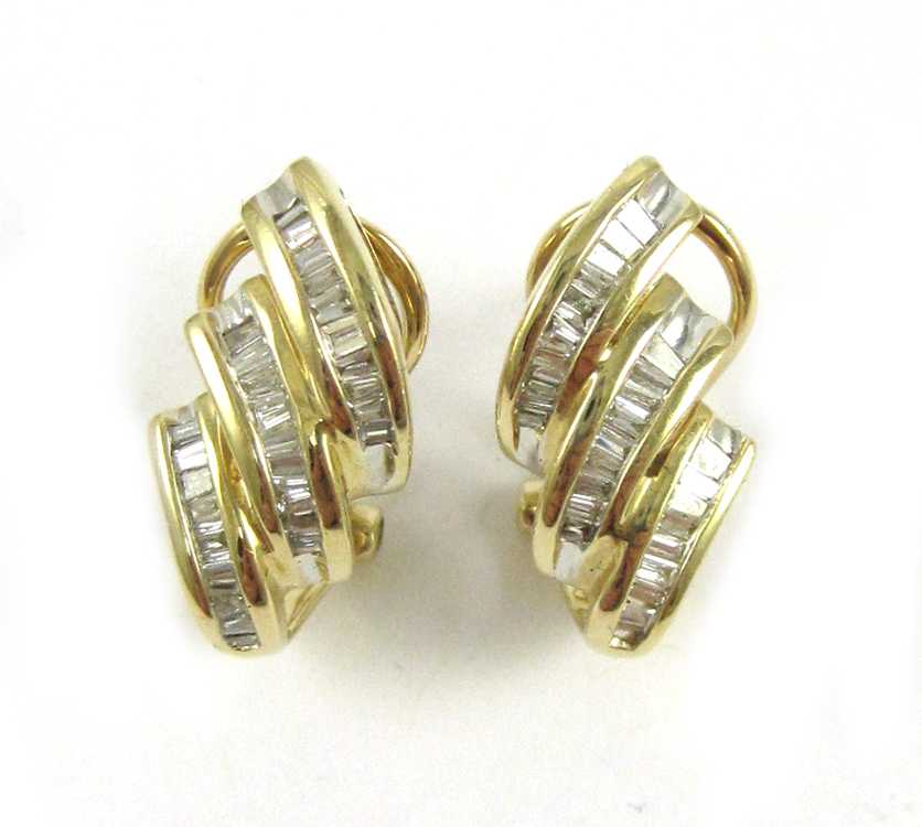 Appraisal: PAIR OF DIAMOND AND YELLOW GOLD OMEGA BACK EARRINGS each