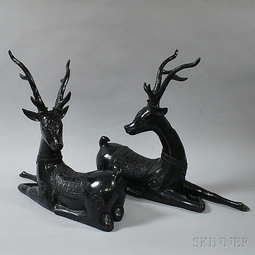 Appraisal: Pair of Black-painted Cast Brass Deer the recumbent figures with