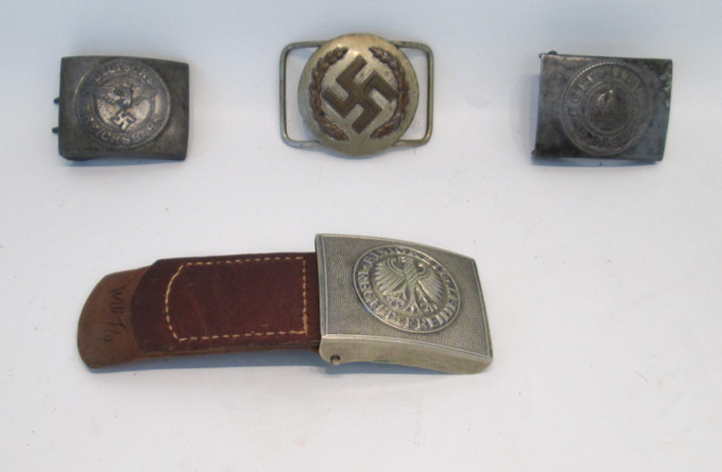 Appraisal: FOUR GERMAN BELT BUCKLES the first a pre WW with