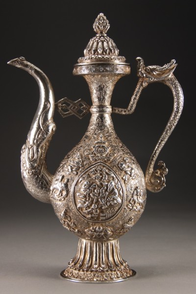 Appraisal: Dragon form handle and spout highly decorated with repouss figures