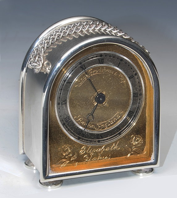 Appraisal: A MODERN SILVER CASED MANTEL CLOCK of domed top form